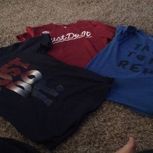 3 boys Nike shirts.